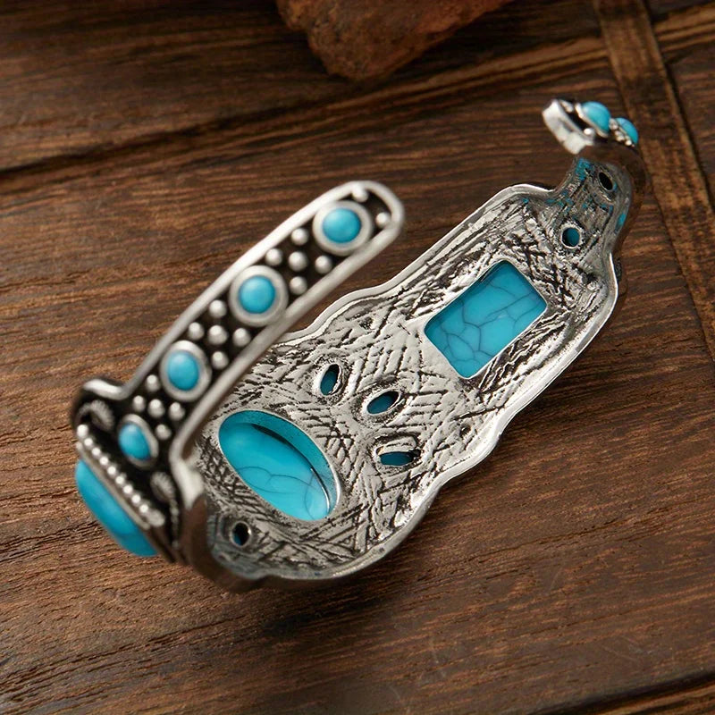 Inside of the open silver cuff showing the stamped metalwork