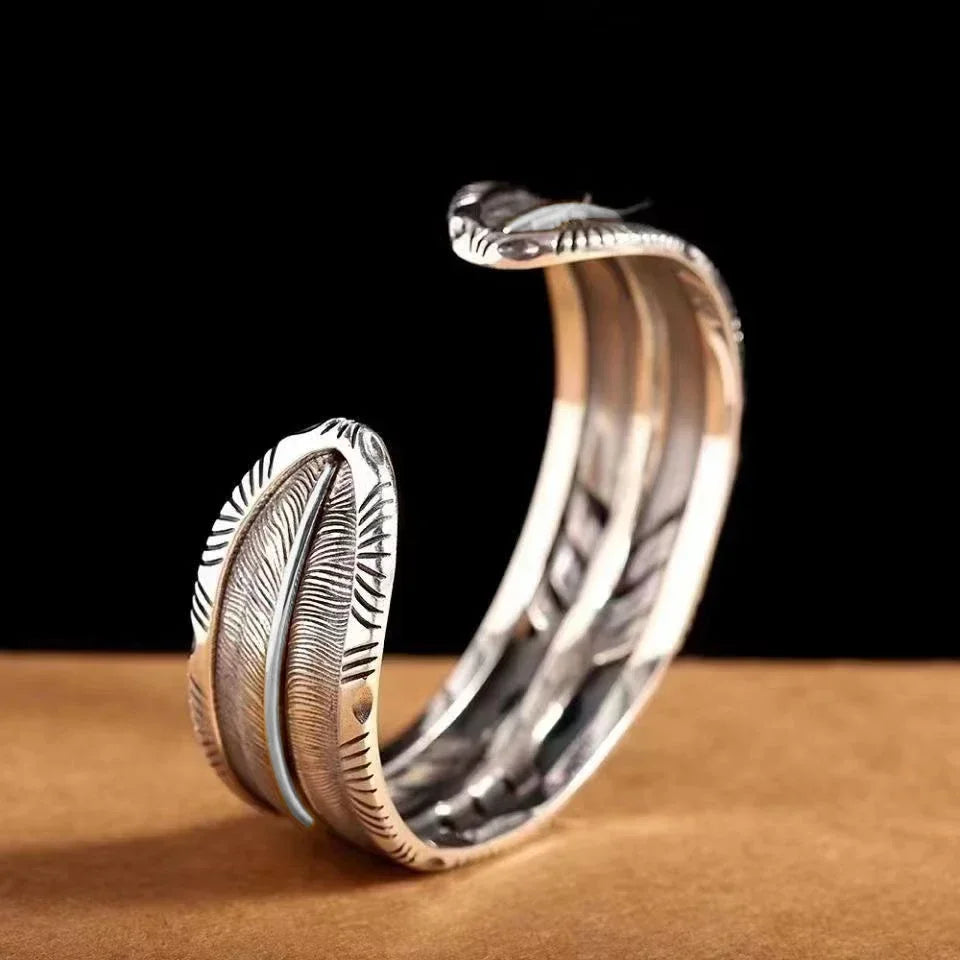 Side view of the turquoise feather silver cuff showing the open band