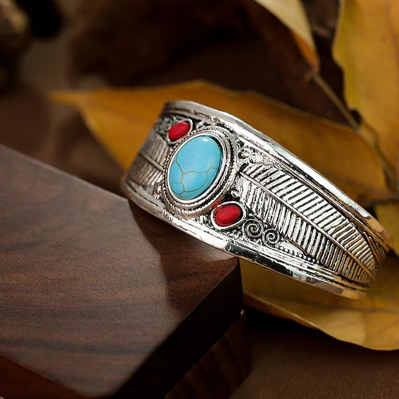 Silver feather turquoise coral cuff angled view
